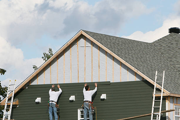 Professional Storm Damage Siding Repair technician working in Bremen, OH
